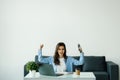 Successful business woman with arms up win gesture at the office Royalty Free Stock Photo