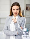 Successful business woman pointing her finger at you in office Royalty Free Stock Photo