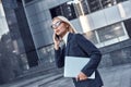 Successful business woman working at laptop in City Royalty Free Stock Photo