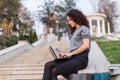 Successful business woman working at laptop and write in agend. Sales woman working using her laptop while writing text.