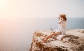 Woman sea laptop. Successful business woman working on laptop by the sea. Pretty lady typing on computer at summer day Royalty Free Stock Photo