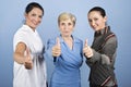 Successful business women giving thumbs up Royalty Free Stock Photo