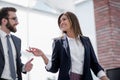 Successful business woman talking to a colleague Royalty Free Stock Photo