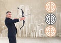 Successful businessman aiming target with bow and arrow Royalty Free Stock Photo