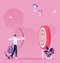 Successful businessman aiming target with bow and key arrow