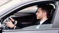 Young businessman driving alone in his new car Royalty Free Stock Photo