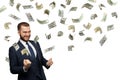 Successful businessman with falling dollar cash money isolated on white background Royalty Free Stock Photo