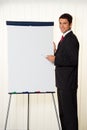 Successful businessman with a flipchart for