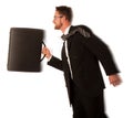 Successful businessman in formal suit and briefcase, running being late. Royalty Free Stock Photo