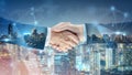 Successful businessman handshake startup new project at city night background, Double exposure of professional teamwork Royalty Free Stock Photo