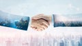 Successful businessman handshake startup new project at city skyline background, Double exposure of professional teamwork Royalty Free Stock Photo