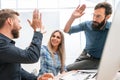 Successful businessman and his colleagues in the workplace in the office Royalty Free Stock Photo