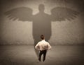 Honest salesman with angel shadow concept Royalty Free Stock Photo