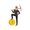 Successful businessman holding pickaxe on shoulder and one leg on golden bitcoin. Self-confident young man in formal Royalty Free Stock Photo