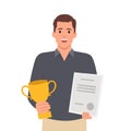 Successful businessman holding trophy and showing award certificate, celebrates his victory. Business success, triumph, goal or Royalty Free Stock Photo