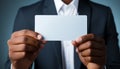 Successful businessman showing empty business card in close up studio shot generated by AI Royalty Free Stock Photo