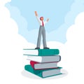 Successful businessman standing on big book stack Royalty Free Stock Photo