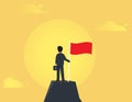 Successful businessman standing on top of mountain holding flag.Achievement and winning concept. Royalty Free Stock Photo