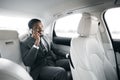 Successful Businessman Talking On Phone Sitting In Luxury Car Royalty Free Stock Photo