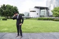 Successful businessman or worker standing in suit near office building Royalty Free Stock Photo