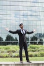 Successful businessman or worker standing in suit near office building Royalty Free Stock Photo