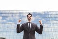 Successful businessman or worker standing in suit near office building Royalty Free Stock Photo