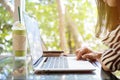 Successful businessman working in cafe during coffee break, Closeup of man`s hands using modern laptop Royalty Free Stock Photo