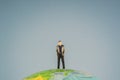 Successful businessmanstanding on top of the world Royalty Free Stock Photo