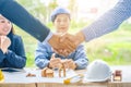 Successful businessmen architects shaking hands. Four businessman architect met in the office to discuss business projects. Royalty Free Stock Photo