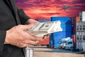 Successful businessmen hold a lot of money on containers box wi Royalty Free Stock Photo