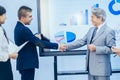 Successful businessmen shaking hands greeting each other on the Royalty Free Stock Photo