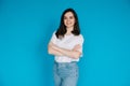 Successful Businesswoman in Casual Attire - Confident Female Office Manager with Crossed Arms - Isolated on Blue Royalty Free Stock Photo