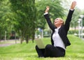 Successful businesswoman with laptop and arms outstretched Royalty Free Stock Photo