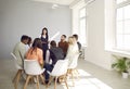 Confident businesswoman lead meeting with diverse colleagues