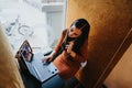 Successful Businesswoman Negotiating Project Costs in Office Phone Booth