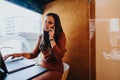 Successful Businesswoman Negotiating Project in Office Phone Booth During Online Meeting