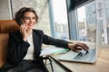 Successful businesswoman in office, having conversation over mobile phone, calling business partner, negotiating Royalty Free Stock Photo