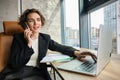 Successful businesswoman in office, having conversation over mobile phone, calling business partner, negotiating Royalty Free Stock Photo