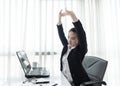 Successful businesswoman relaxing in her chair at the office Royalty Free Stock Photo