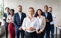 Successful Businesswoman Standing In Front Of Business Team In Office Royalty Free Stock Photo