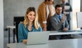 Successful businesswoman using laptop, working in office. Business technology corporate concept Royalty Free Stock Photo