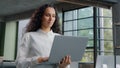 Successful businesswoman working in modern office typing on laptop remote communicating with client developing project Royalty Free Stock Photo