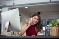 Successful businesswoman working at the office, Attractive young woman talking on the mobile phone Royalty Free Stock Photo