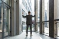 Successful Caucasian businessman with arms up celebrating victory. Concept: success, career growth, victory, freedom. silhouette