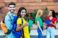 Successful caucasian male and latin american female student Royalty Free Stock Photo
