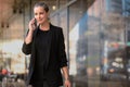 Successful CEO business owner, confident female executive busy talking on mobile phone while walking to work Royalty Free Stock Photo