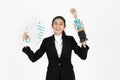 Successful cheerful young Asian business woman celebrating with trophy award over white isolated background. Success achievement Royalty Free Stock Photo