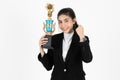 Successful cheerful young Asian business woman celebrating with trophy award over white isolated background. Success achievement Royalty Free Stock Photo