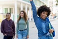 Successful cheering african american female student with backpack and group of international students Royalty Free Stock Photo