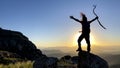 The successful climb of the mountaineer and the expression of the happiness of reaching the goal Royalty Free Stock Photo